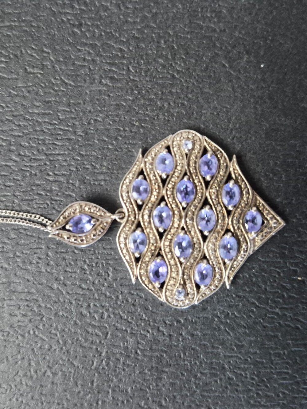 Necklace with purplish stone pendant